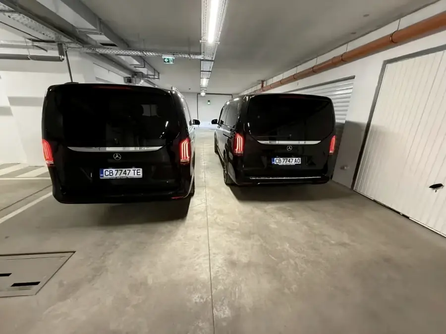 Two black Mercedes V-Class in an underground car park