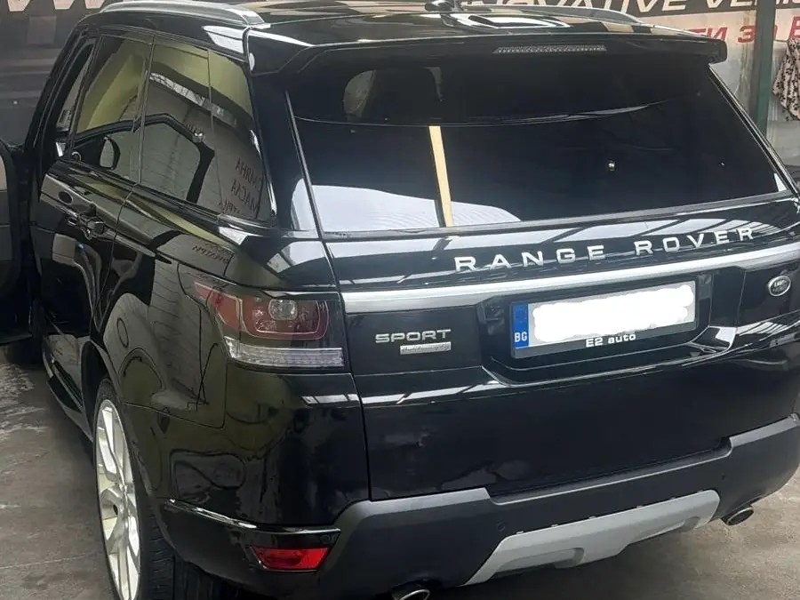 Black Range Rover in a showroom